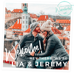 Travel bloggers Lia and Jeremy in front of a colorful background with welcoming text.